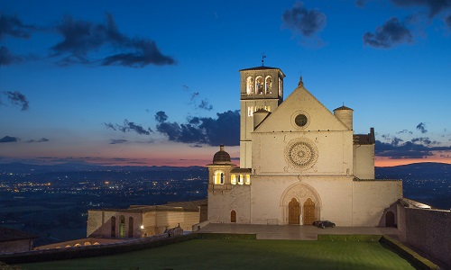 The Papal Basilica Of St. Francis Of Assisi At Sunset